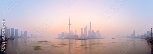 Pudong skyline across Huangpu River, including Oriental Pearl Tower, Shanghai World Financial Center, and Shanghai Tower, Shanghai, China, Asia photo