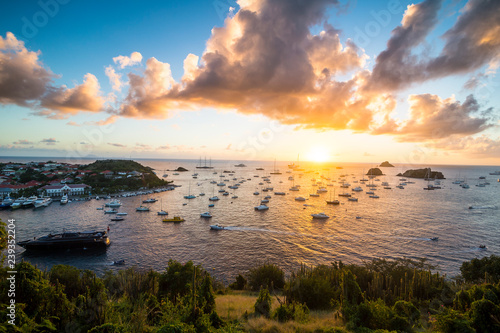 Sunset over the luxury yachts, in the harbour of Gustavia, St Barth or Saint Barthelemy, Greater Antilles photo