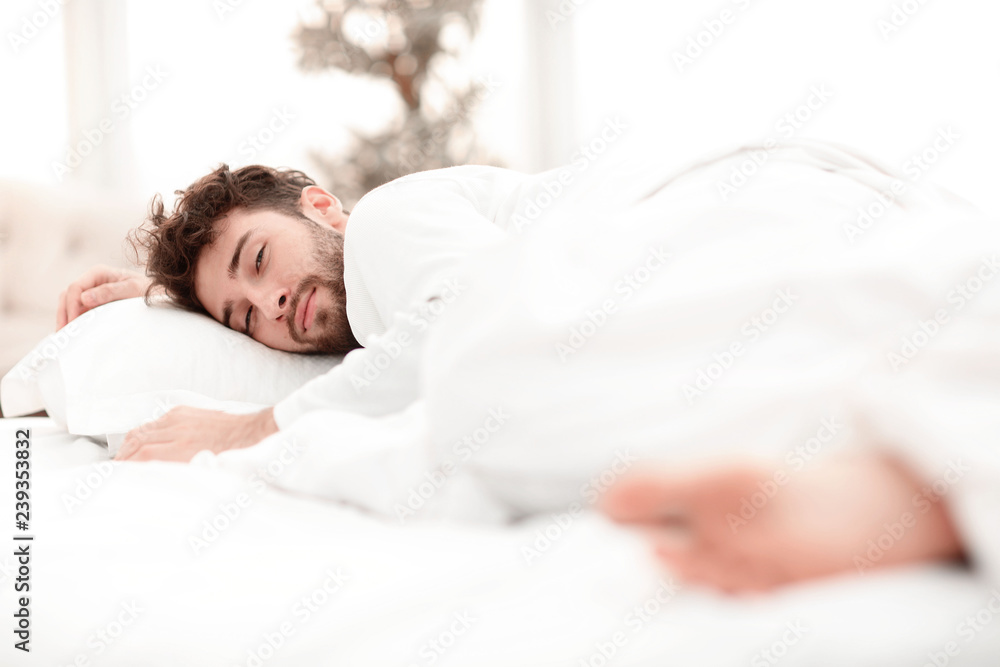 closeup.the tired men sleep soundly on the bed closeup.the tired men sleep soundly on the bed