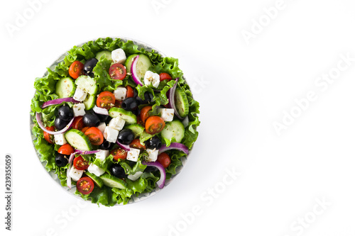 Fresh Greek salad in Plate with black olive,tomato,feta cheese, cucumber and onion isolated on white background. Top view. Copyspace © chandlervid85