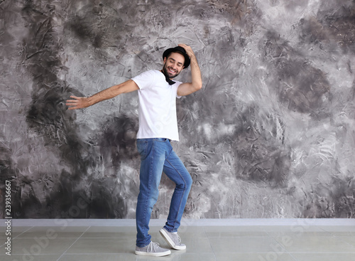 Handsome young man dancing ...