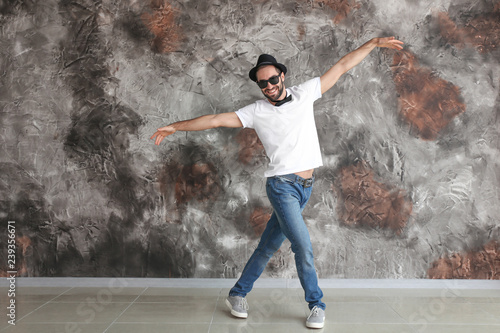 Handsome young man dancing ...