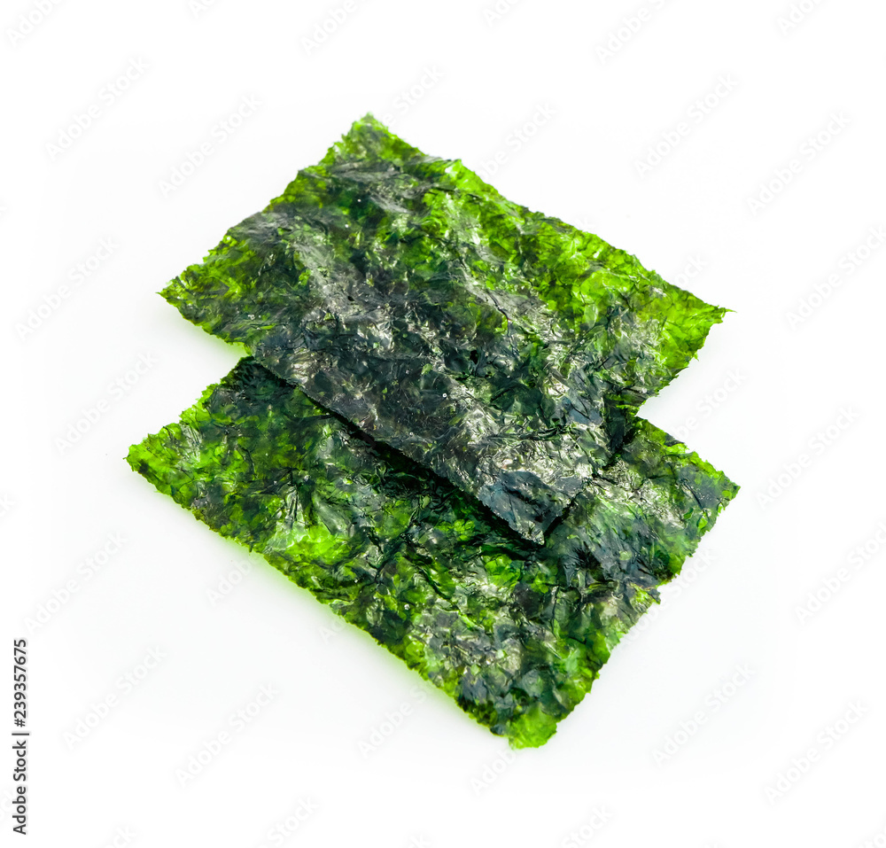 Two roasted sheets of seaweed, isolated on white background. Asian healthy dry nori snack food. Two roasted sheets of seaweed, isolated on white background. Asian healthy dry nori snack food.