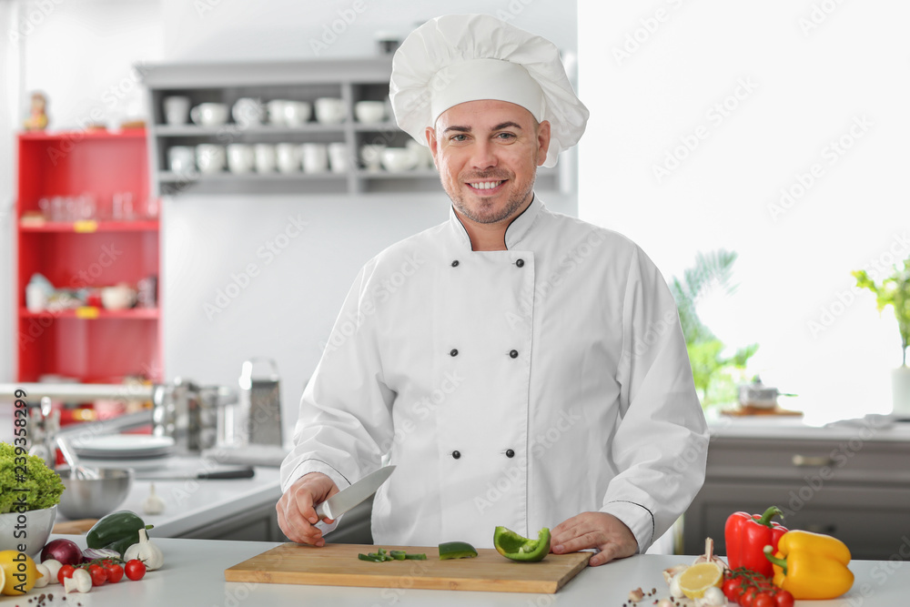 Portrait of male chef in kitchen