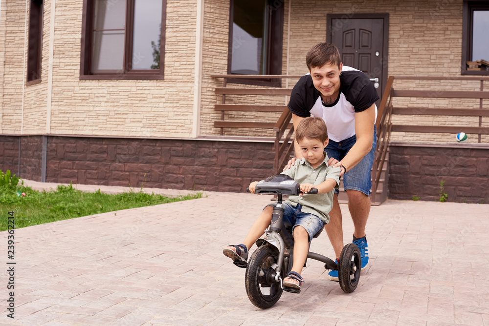 Happiness Father and son on the bicycle outdoor Happiness Father and son on the bicycle outdoor