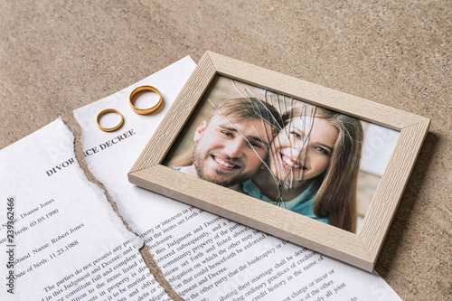 Torn divorce decree, rings ...