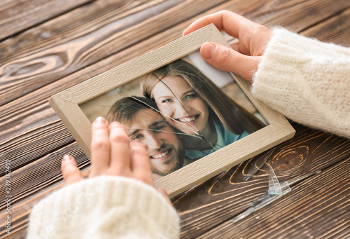 Woman holding photo of happ...