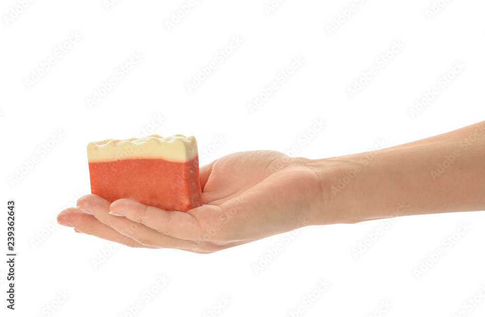 Female hand with soap bar on white background Female hand with soap bar on white background