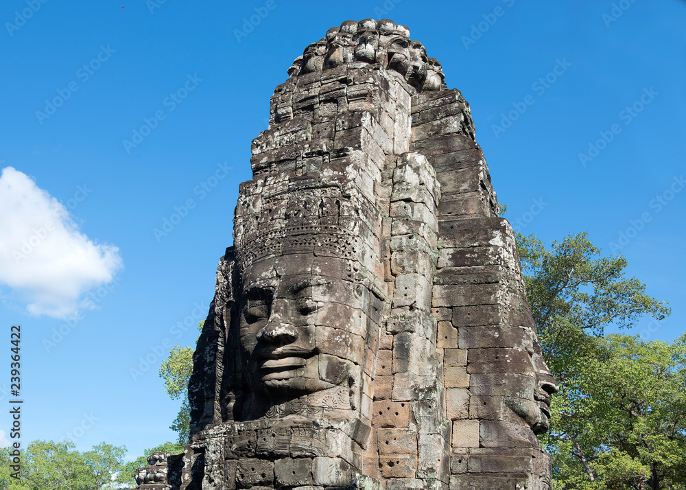 Fototapeta premium Faces of Bayon temple in Angkor Thom, Siemreap, Cambodia. The Bayon Temple (Prasat Bayon ) is a richly decorated Khmer temple at Angkor , ancient architecture in Cambodia