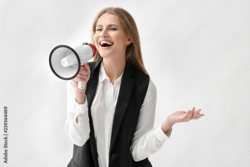 Businesswoman with megaphone on white background Businesswoman with megaphone on white background
