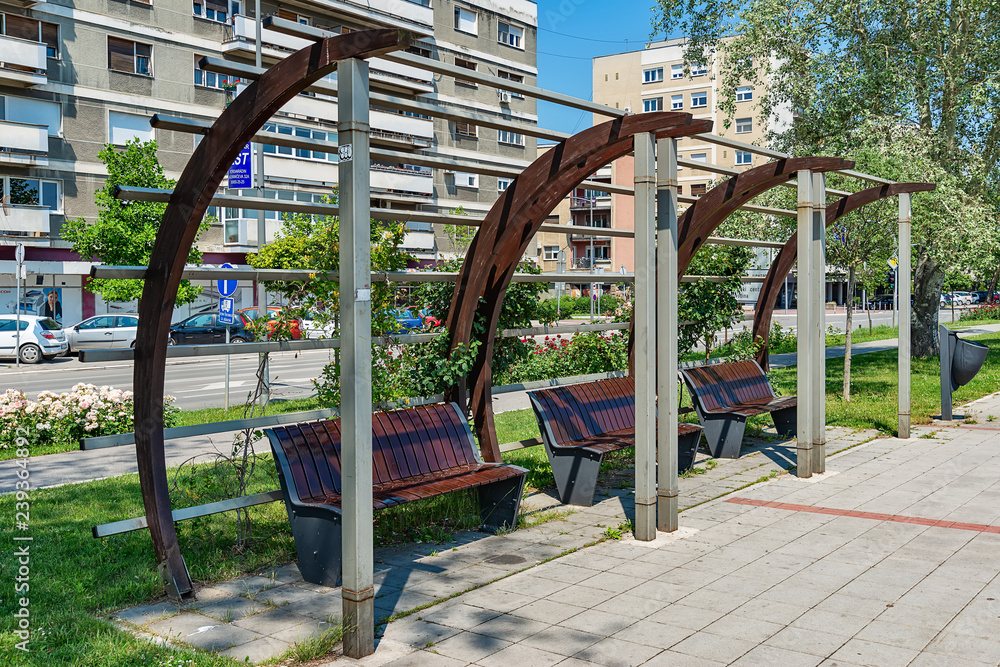 Novi Sad, Serbia - May 27, 2018: Park at the Belgrade Quay with place for free wi-fi in Novi Sad. The bench is decorated with flowers.