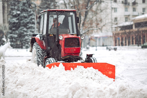 Snow machine cleans the snow in the city.