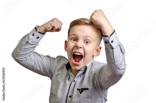 Angry boy with a black eye is threatening his fist. Bully 9-year-old with a shiner. White background, front view.