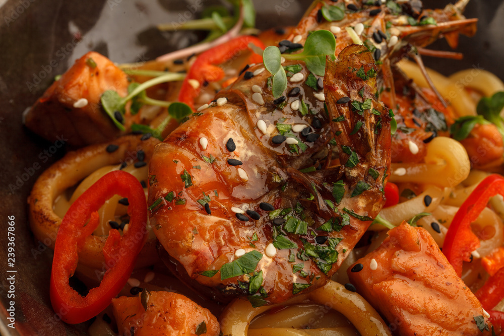 Stir fry with udon noodles, shrimps (prawns) and vegetables. Asian healthy food, meal Stir fry with udon noodles, shrimps (prawns) and vegetables. Asian healthy food, meal