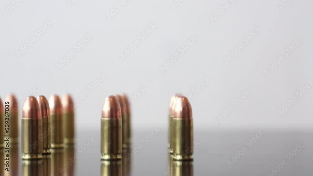9mm Bullets in straight lines Dolly shot of 9mm Bullets in straight lines 9mm Bullets in straight lines Dolly shot of 9mm Bullets in straight lines