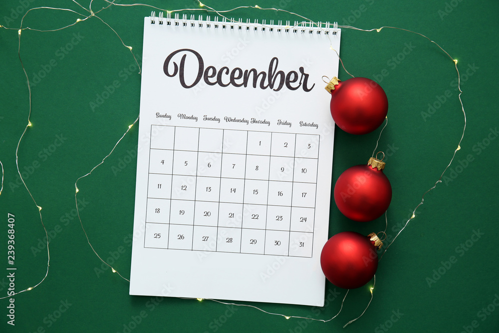 Calendar page of December on color background Calendar page of December on color background