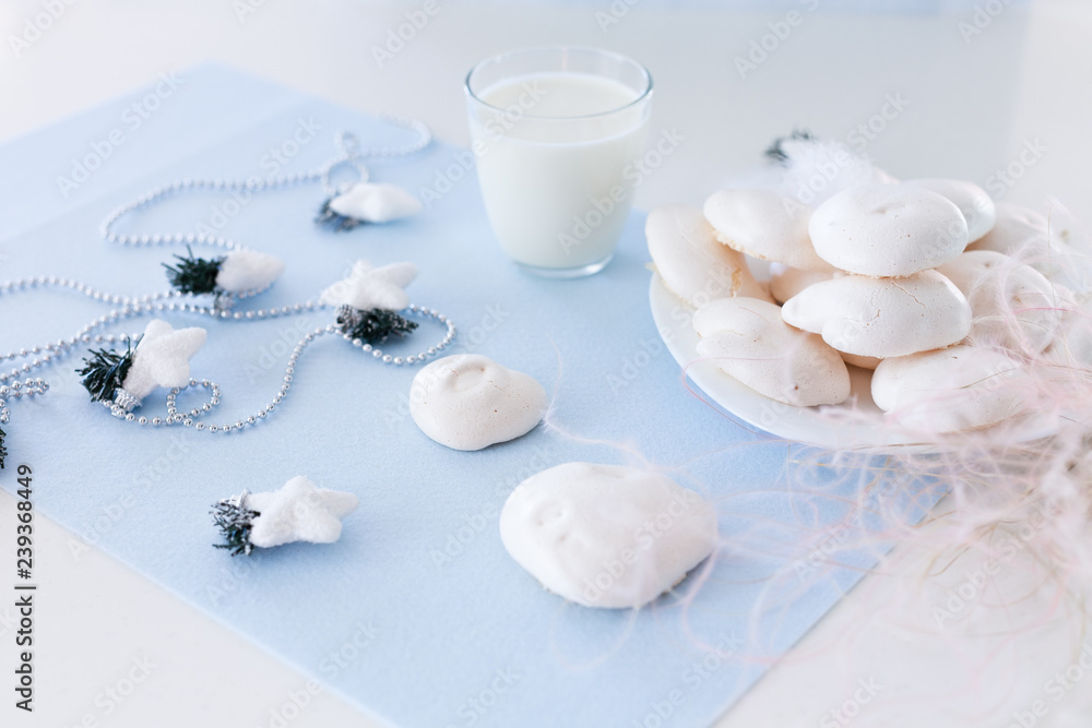 Homemade meringue cookies and glass of milk Homemade meringue cookies and glass of milk