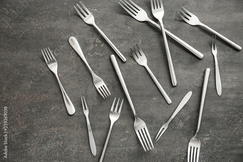 Set of forks on grey background