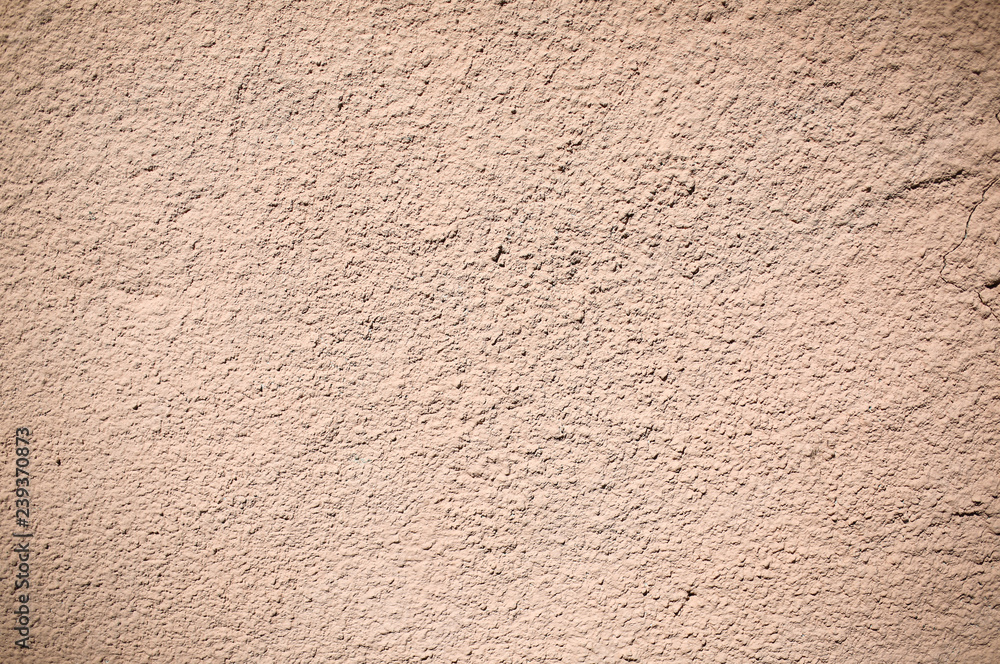 Beige wall texture background. Ribbed surface with holes and scratches. Beige wall texture background. Ribbed surface with holes and scratches.
