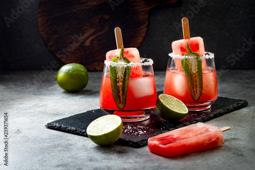 Spicy watermelon popsicle margarita cocktail with jalapeno and lime. Mexican alcoholic drink for Cinco de mayo party photo