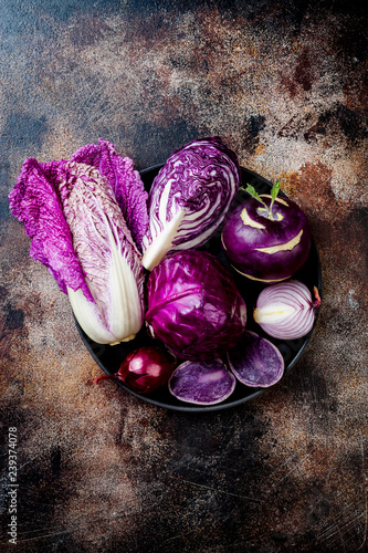 Seasonal winter autumn purple vegetables background. Plant based vegan or vegetarian cooking concept. Clean eating food, alkaline diet photo