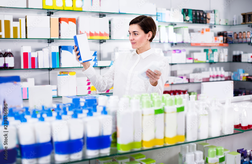 Customer woman is browsing rows of body care products
