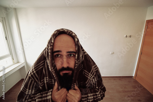 Paranoid man with agoraphobia scared at home photo