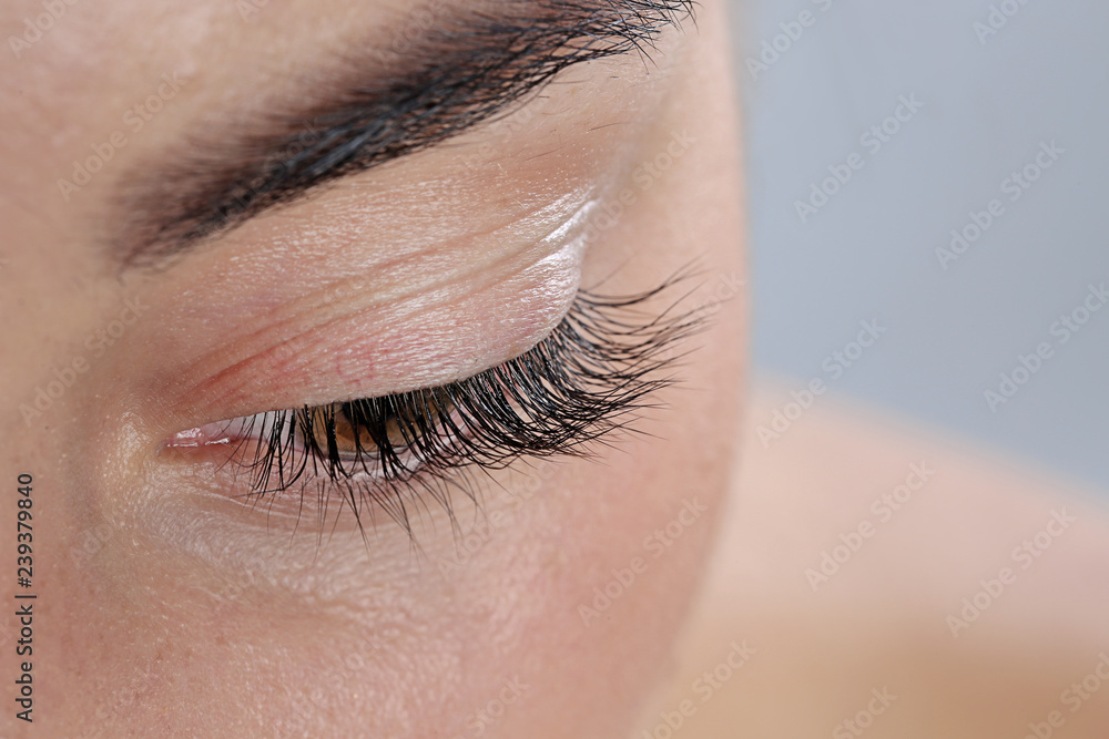 Fototapeta premium Young woman with beautiful eyelashes, closeup view