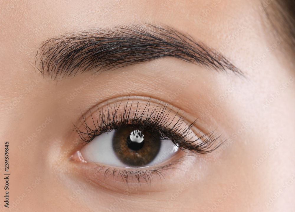 Young woman with beautiful eyelashes, closeup view Young woman with beautiful eyelashes, closeup view