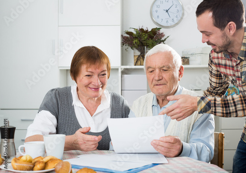 Elderly couple and social employee photo