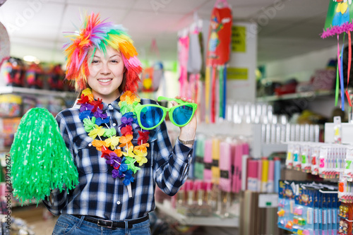 Girl in store of festival accessories