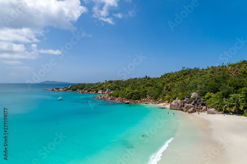 Aerial view of sandy beach with tourists swimming in beautiful clear sea water © gawriloff