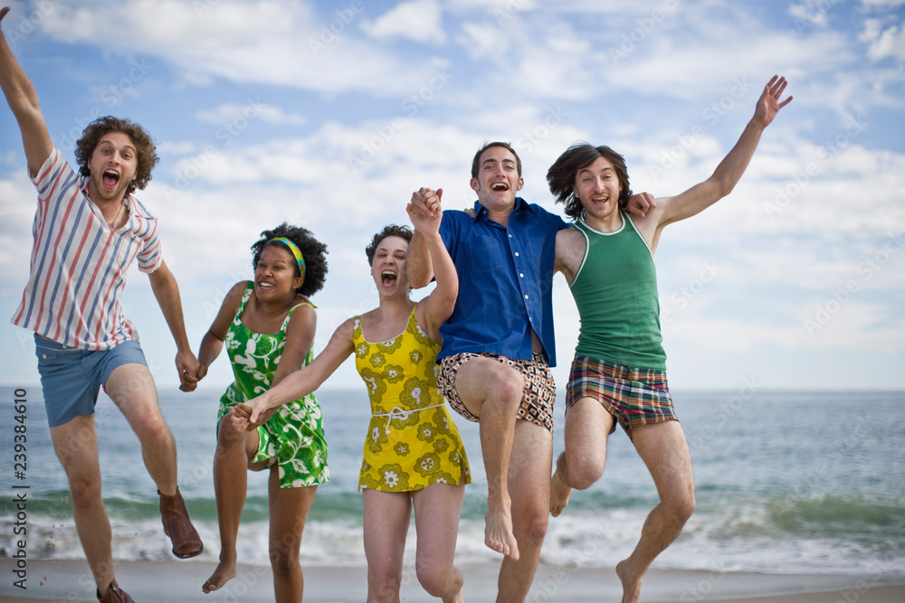Group of young adults having fun together at the beach. Group of young adults having fun together at the beach.