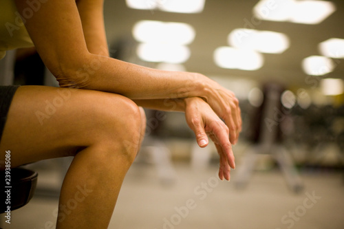 Wallpaper Mural Women's hands and legs resting in a gym. Torontodigital.ca
