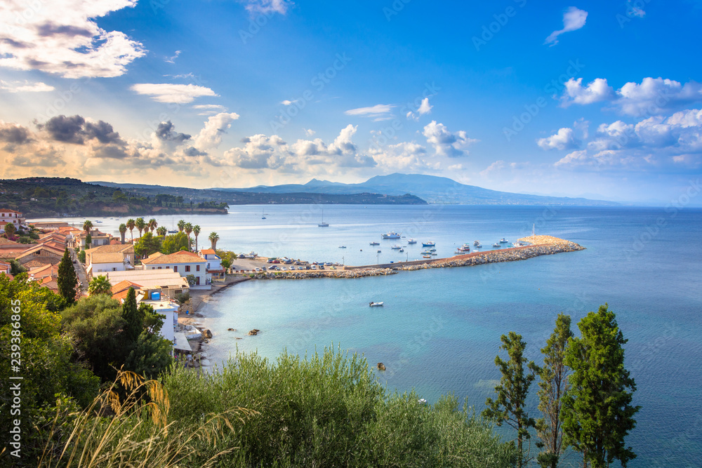 View of traditional fishing village of Koroni, Greece and its small harbour