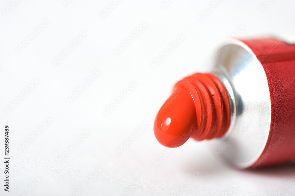 Red acrylic paint squeezed out of the tube. Selective focus and shallow depth of field. Red acrylic paint squeezed out of the tube. Selective focus and shallow depth of field.