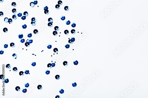 Fotografie Round blue sequins on white background