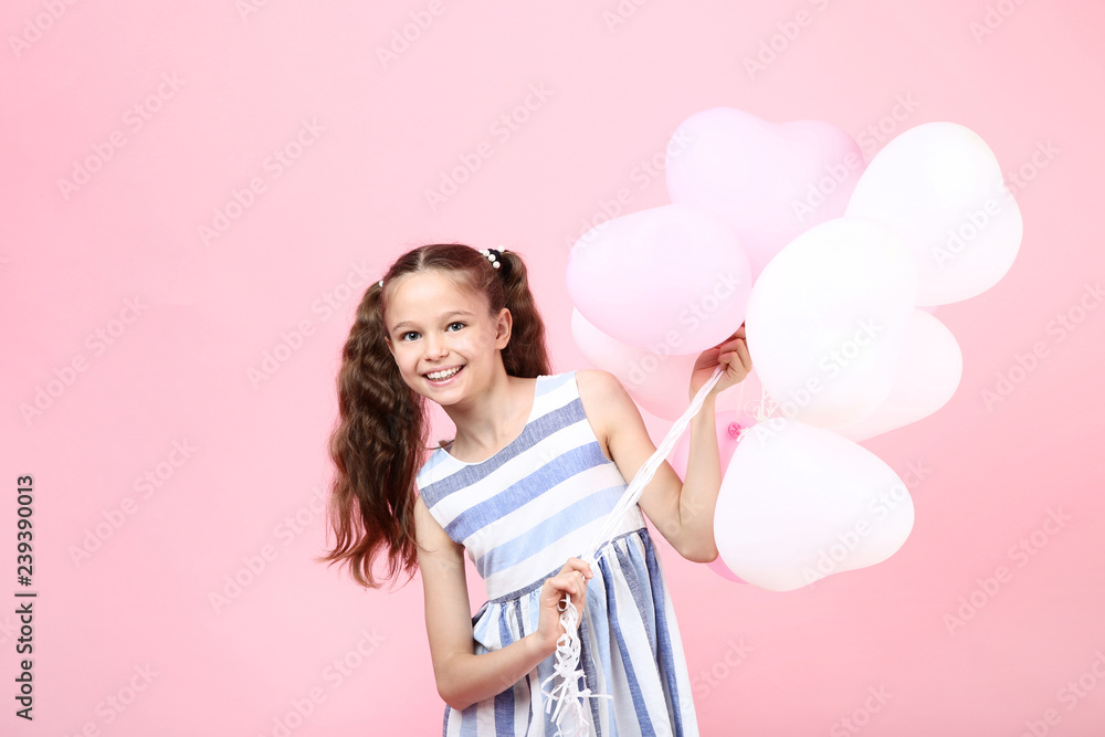 Young girl with balloons on pink background Young girl with balloons on pink background