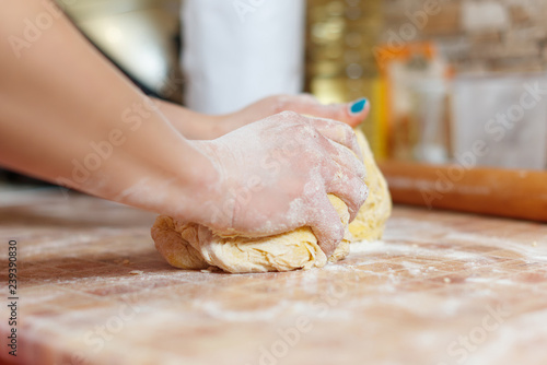 close up of girl making pasta the traditional way
