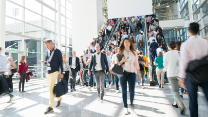 blurred business people at a trade fair