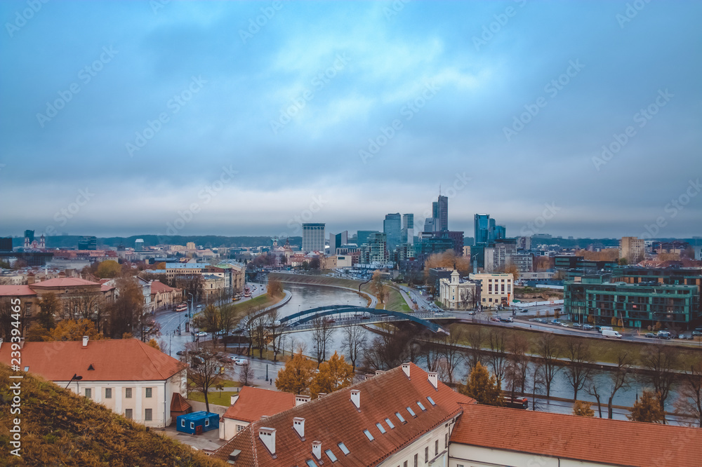 Evening view from remaining part of the Upper Vilna Castle, near Gediminas' Tower, on Skyscrapers of New Center and Neris river, Vilnius (Republic of Lithuania). October 23, 2018.