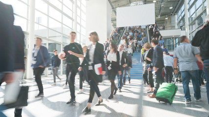 blurred business people at a trade fair