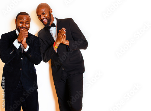 two afro-american businessmen in black suits emotional posing, g photo