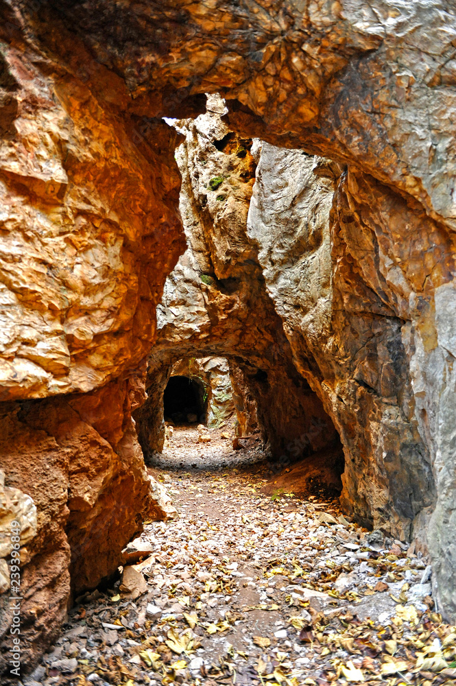 Mining tunnel in Cerro del Hierro (The Iron Hill) , eroded landscape of old abandoned mines in the Natural Park Sierra Norte of Seville, Andalusia, Spain