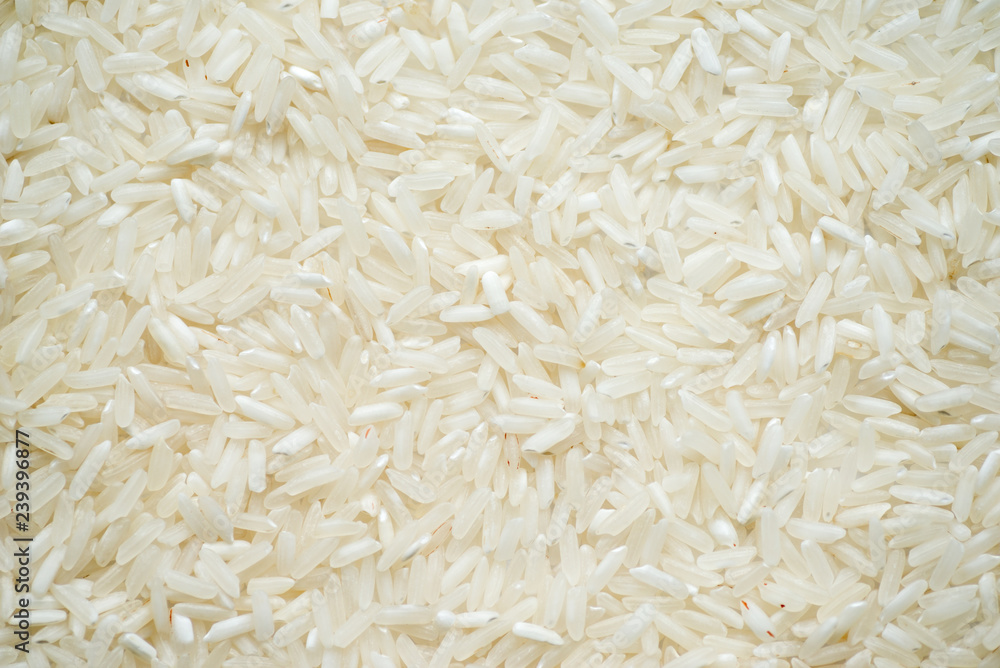 White long rice background, uncooked raw cereals, macro abstract top view background