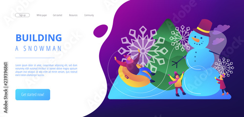 Happy people having fun outdoor in winter sledding and making snowman. Winter outdoor fun, building a snowman, snowball fight and sledding concept.Website vibrant violet landing web page template.