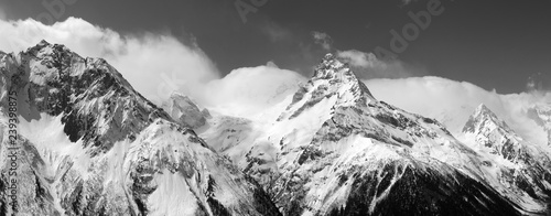 Black and white panorama of snowy mountains photo