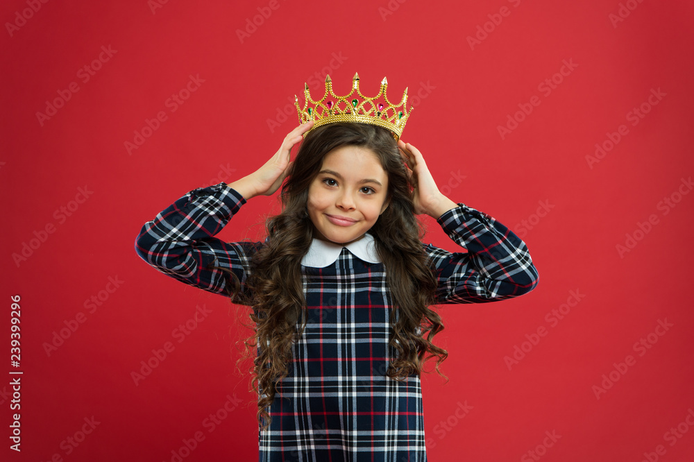 Monarch attribute. Kid wear golden crown symbol of princess. Every girl dreaming to become princess. Lady little princess. Girl wear crown red background. Monarch family concept. Princess manners