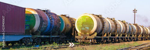 Transportation of oil tanks at sunset, transportation by rail