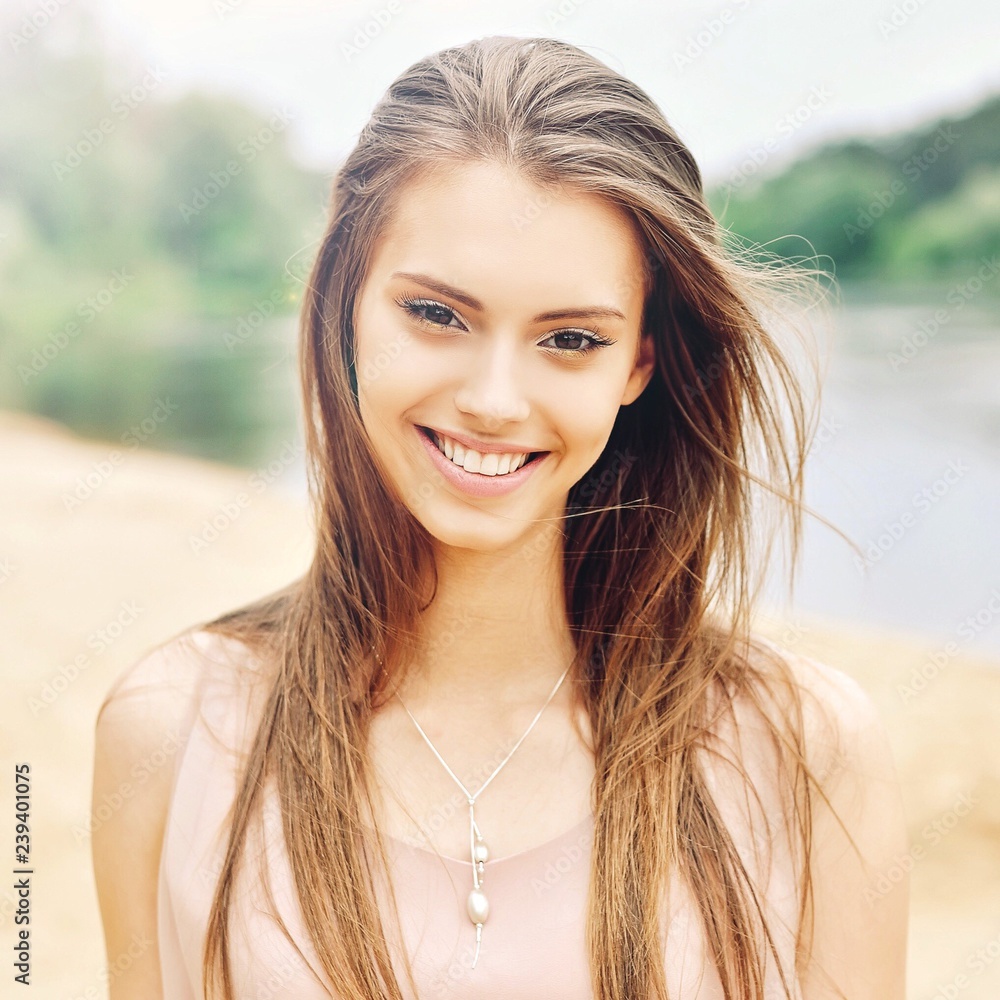 Fototapeta premium Beautiful smiling girl face - close up